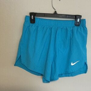 Nike 4” Fast racing shorts. Never been worn.